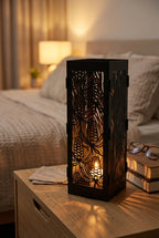 The Ember Tower Candle Lantern - Powdercoated Black with lit tealight, lifestyle